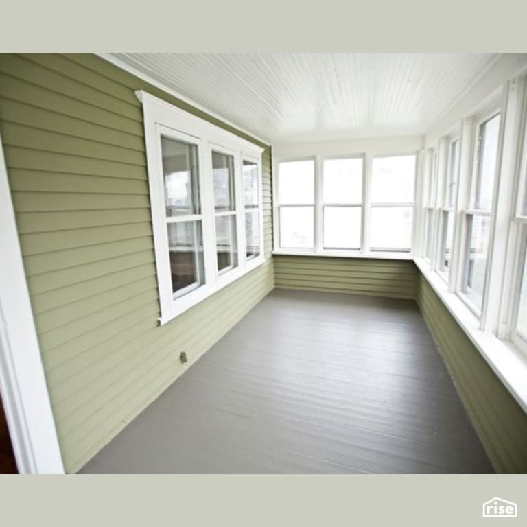 Exterior Sun Porch with Clapboard Wood Siding by Constructive Builders