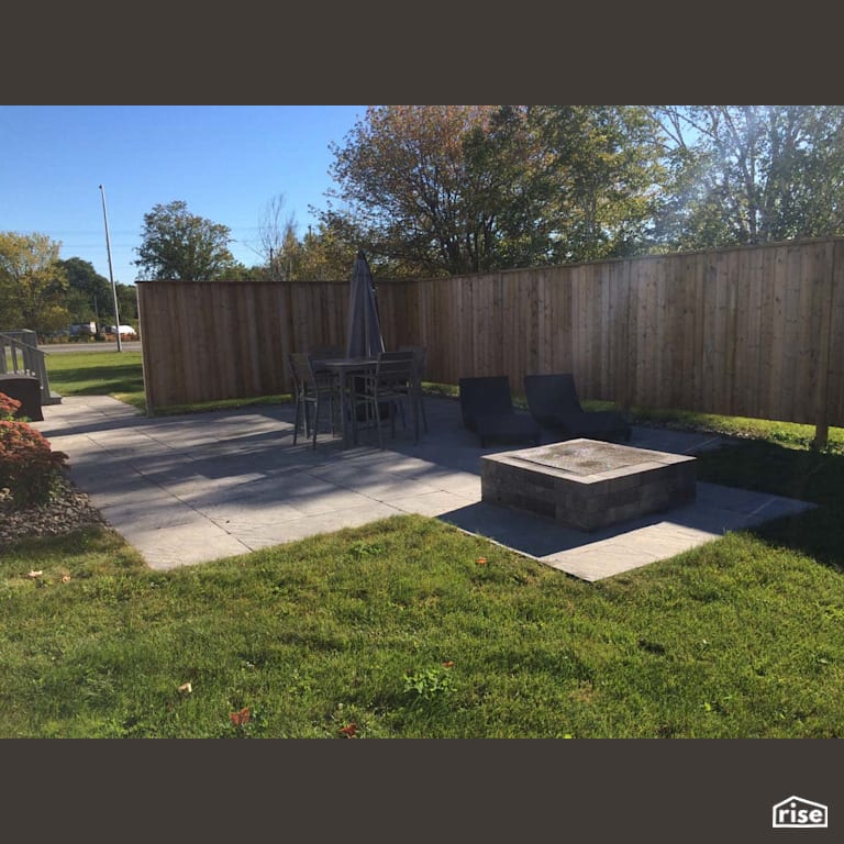 Backyard Patio and firepit with Patio Stone by Earthworks Landscape & Design