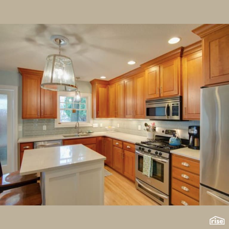 Kitchen with Gas Range by Constructive Builders