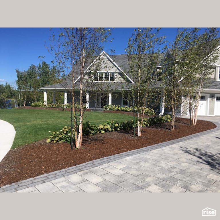 Front Landscaping with Wood Mulch by Earthworks Landscape & Design