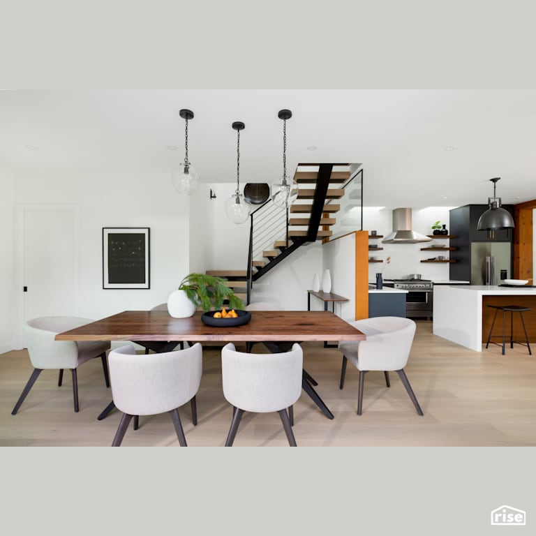Dining Room in Open Concept Kitchen with Gas Range by Synthesis Design