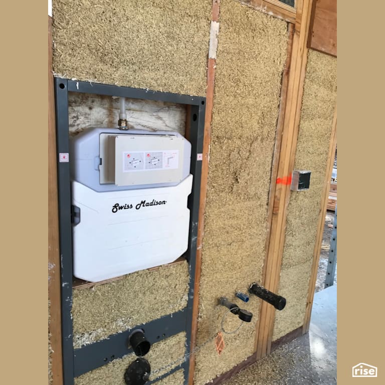 HempLime walls with in-wall tank carrier system with Wall-hung Dual Flush Toilet by Hemp Eco Systems Group