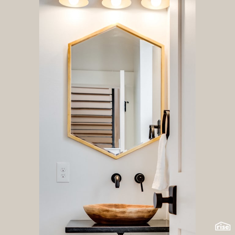 Wooden sink on vanity with Low-Flow Bathroom Faucet by Revolve Design Build