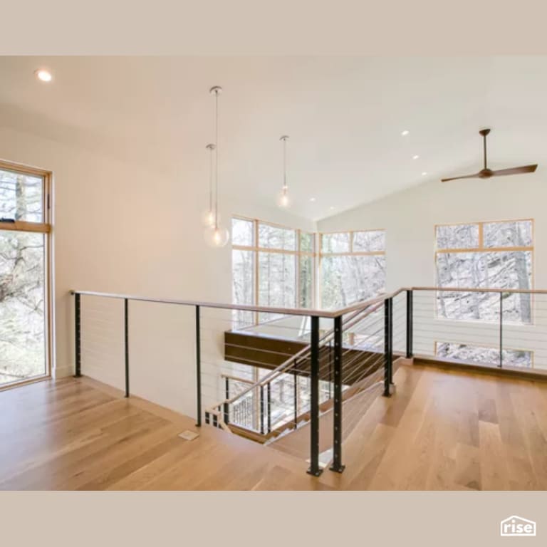 Staircase with Laminate Flooring by Constructive Builders