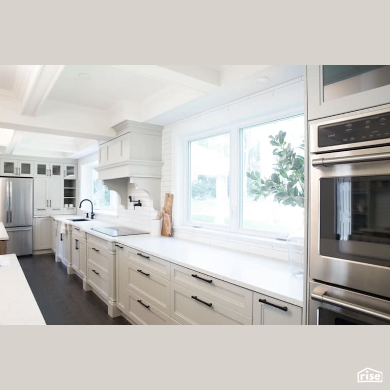 Open kitchen with double wall oven with Refrigerator by Reimagine Designs