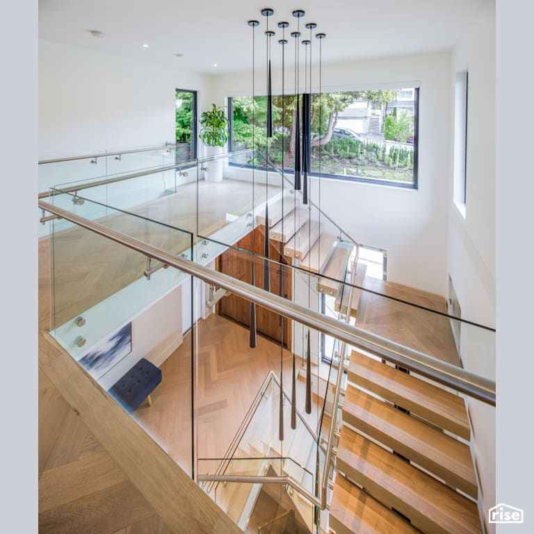Looking Down the Stairs to the Front Door with LED Lighting by Synthesis Design
