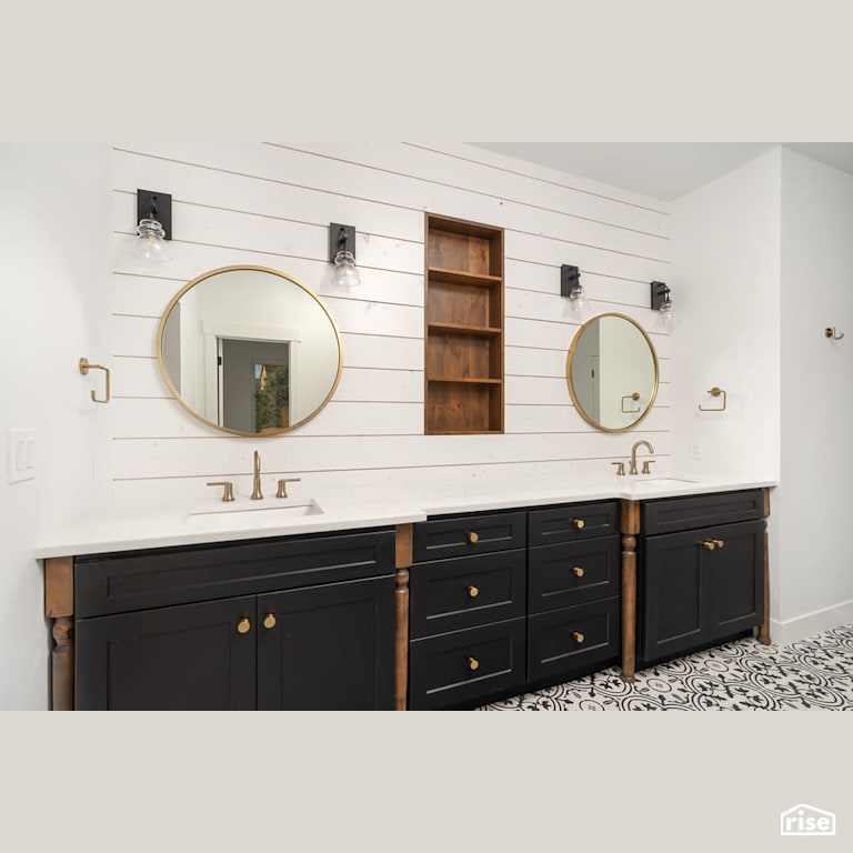 Dual vanity with circular mirrors with Low-Flow Bathroom Faucet by Revolve Design Build