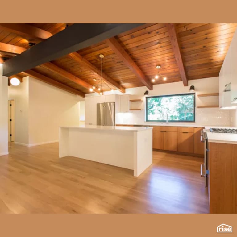 Kitchen with Laminate Flooring by Constructive Builders