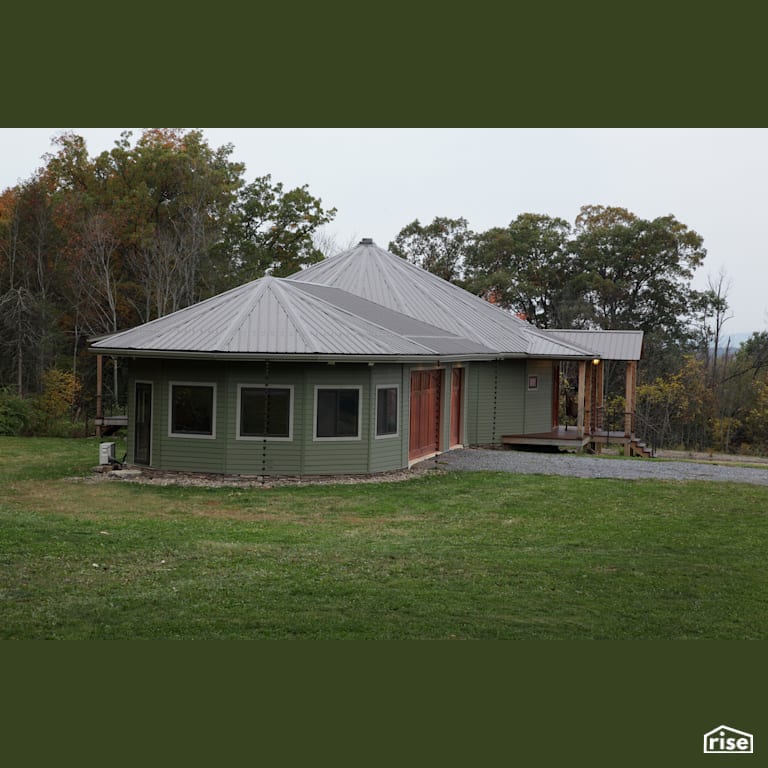 Roundhouse with ductless mini split heat pump with Standing Seam Metal Roof by Deltec Homes