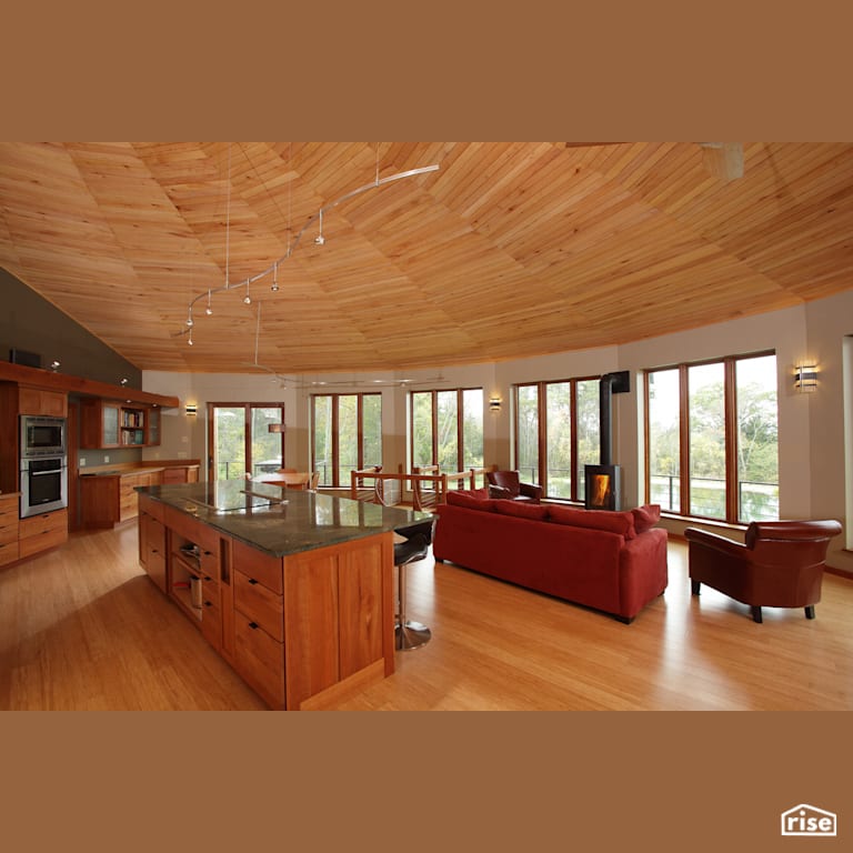Open concept kitchen with lots of natural light with Laminate Flooring by Deltec Homes