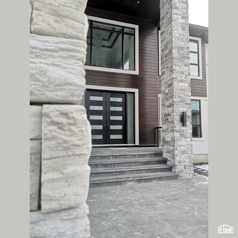 Entryway with brown composite soffits and entryway with Integrated LED by ChamClad by Chameleon