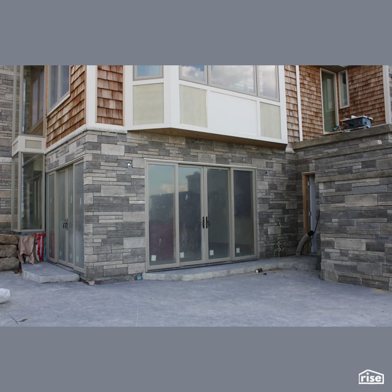 House with Stone Siding and Stone Patio area with Stone Siding by Masonal Stone Inc