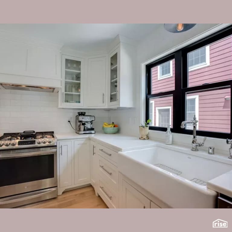 Kitchen with Range Hood by Constructive Builders