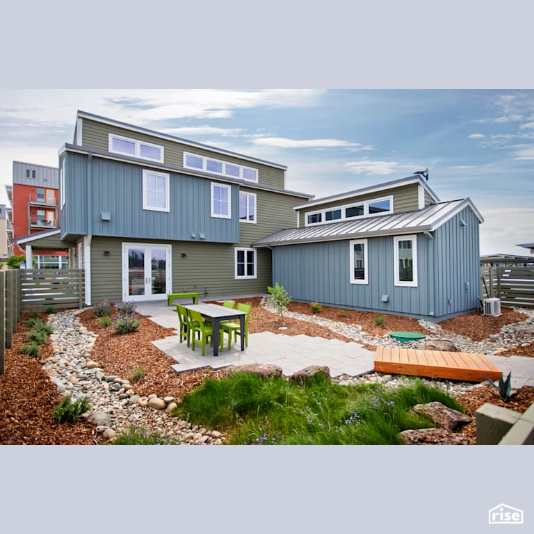 Rear patio with xeriscaped landscaping with Fixed Window by Alpen High Performance Products