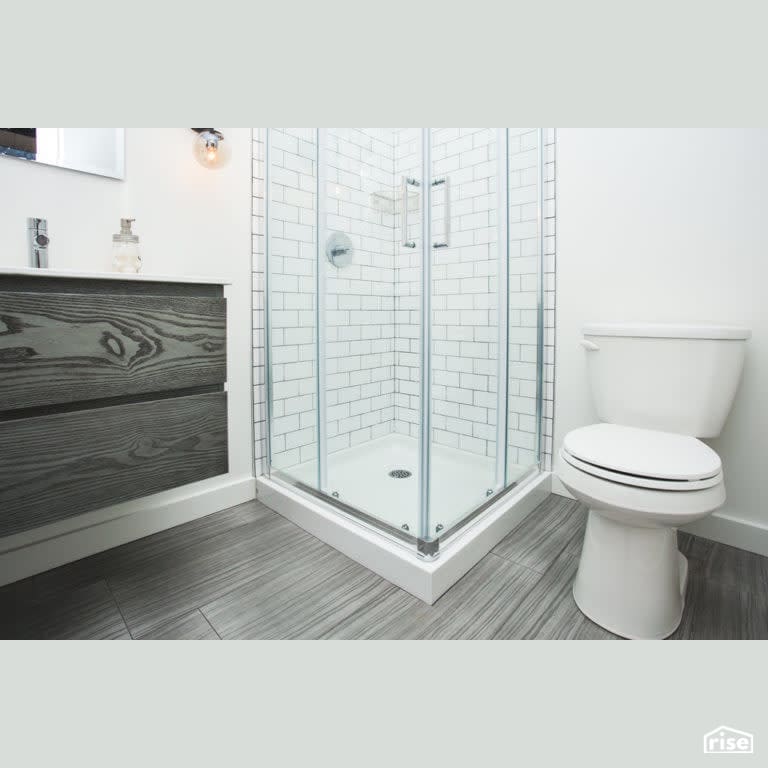Bachelor Pad Renovation Bathroom with Low-Flow Bathroom Faucet by Vantage Build