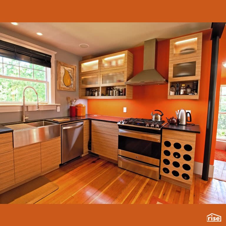 Orange Kitchen with Gas Range by RSI Projects