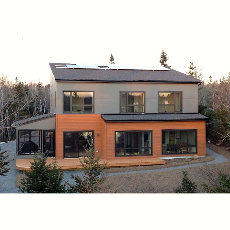 Turner House Exterior with Clapboard Wood Siding by Passive Design Solutions
