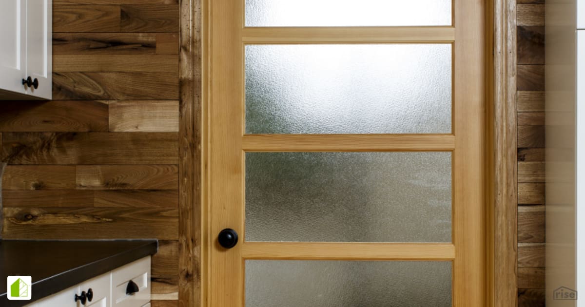 Red Castle Kitchen Door with Reclaimed Hardwood by The Conscious Builder