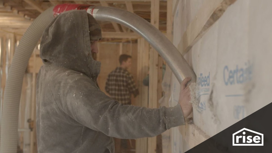 installing insulation in a double studded wall