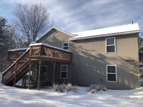 Back of the house in the snow Brett Little