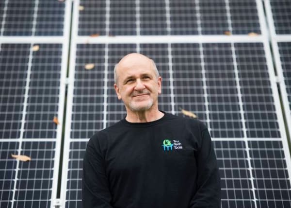 Bill in Front of Solar Panels Nate Smallwood for the Tribune Review