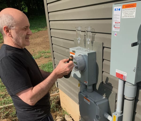 Bill Opening Champagne When His Array Was Connected to the Grid