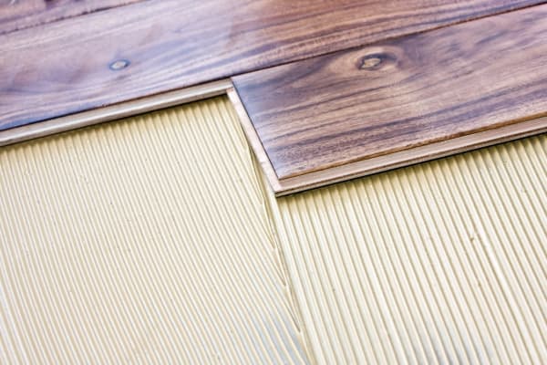 Engineered Wood Being Glued
