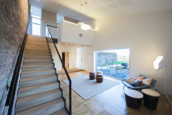ZEB net zero home staircase and living room