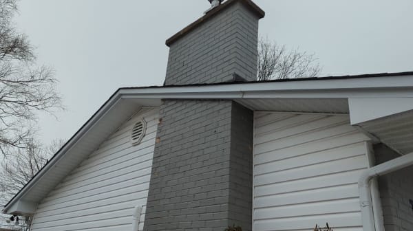 chimney on outside wall of house