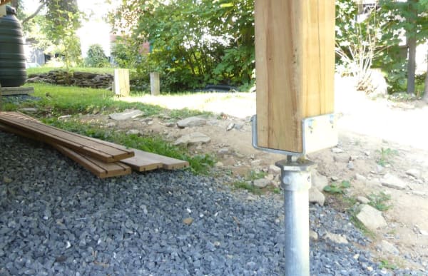 Helical pier supporting a deck