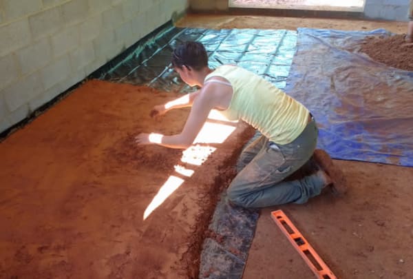 pouring adobe floor