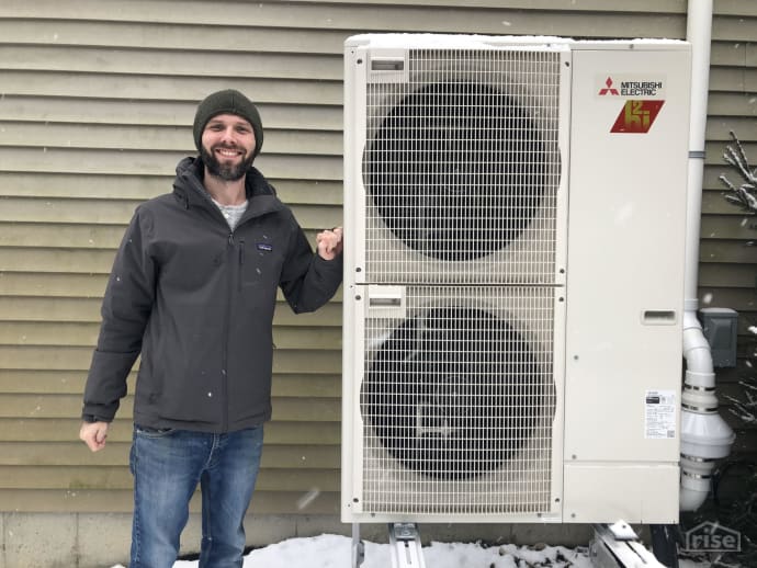 Brett Little Outside with Air Source Heat Pump