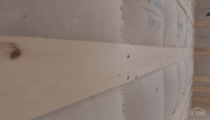Cellulose insulation wood strapping