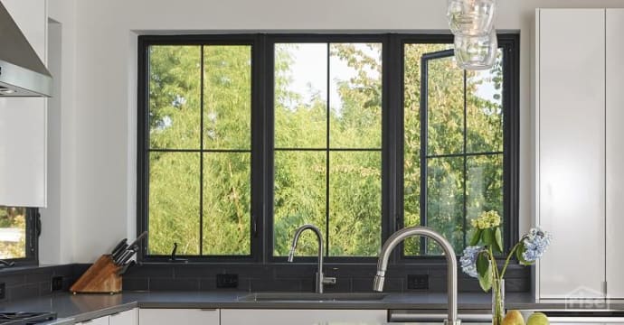 black window in kitchen by milgard