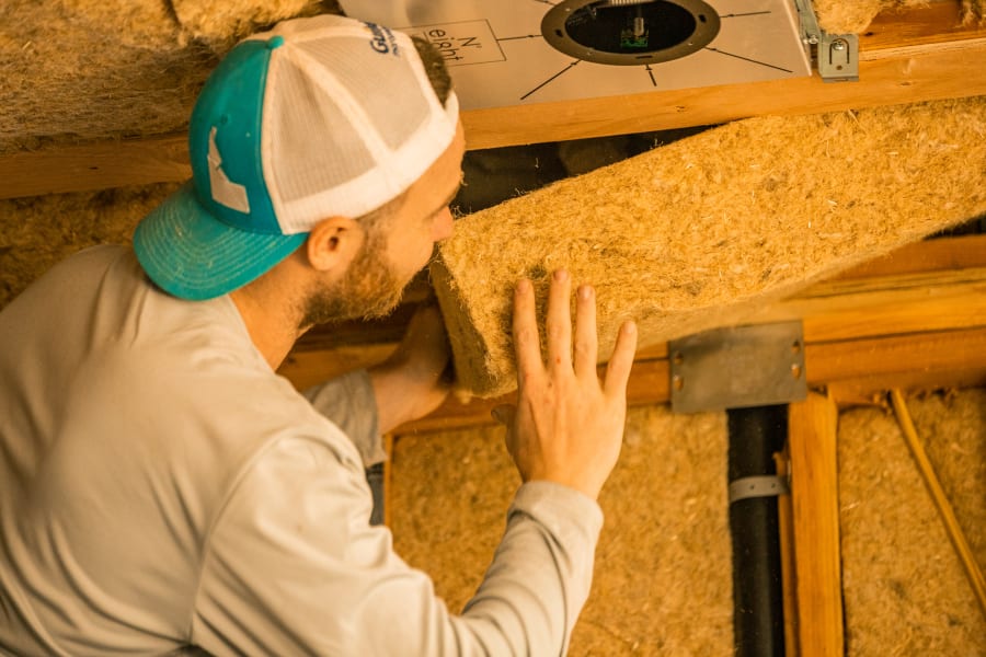 Rise Pressing HempWool Batts Into Place with Hemp Batt Insulation by