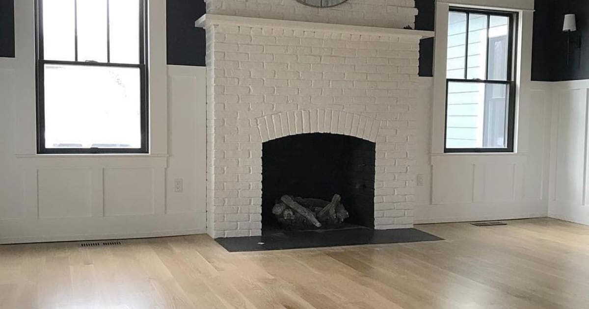 Rise Finished wood flooring around white fireplace with Interior Wood