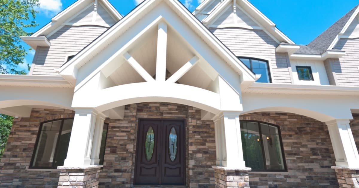 Rise 50 Via Roma Way Exterior with Stone Siding by Martell Homes