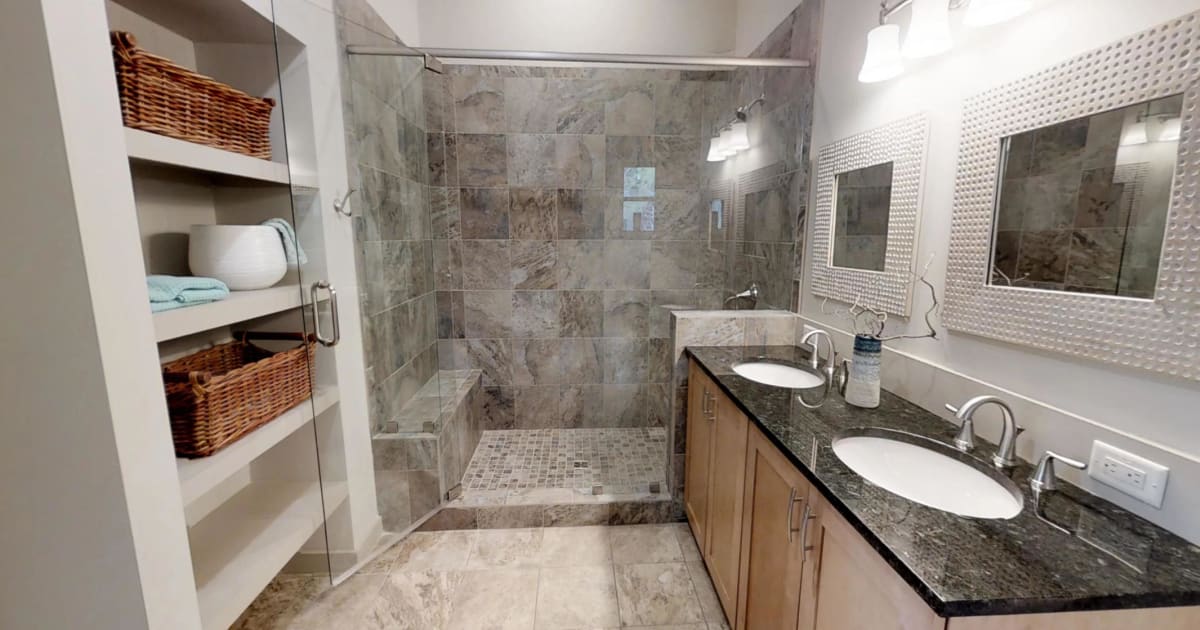 Rise Tiled shower with low with Ceramic Tile Floors by Deltec Homes