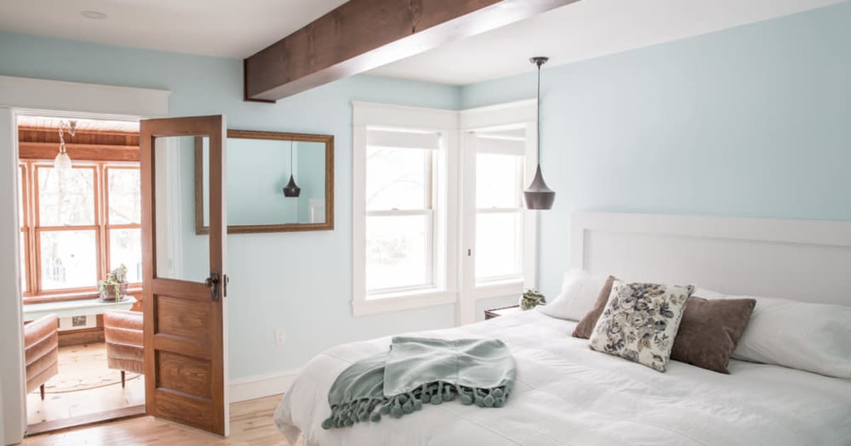 Rise Bright bedroom with sky blue walls with Engineered Hardwood by Reimagine Designs